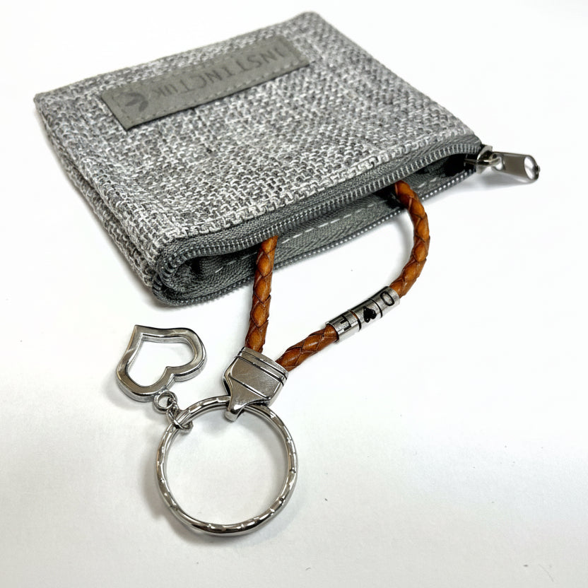 Gray textured wallet with a keychain featuring a heart-shaped keyring on a white background
