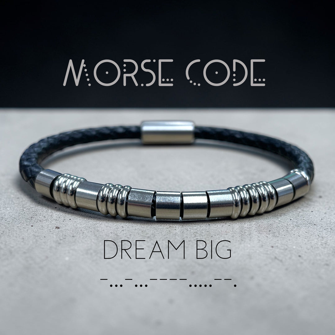 Leather and stainless steel bracelet featuring the message dream big n morse code