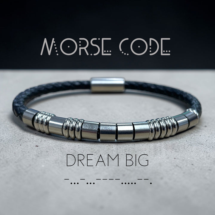 Leather and stainless steel bracelet featuring the message dream big n morse code